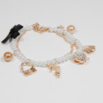 Perlový náramok s rose gold príveskami N050-25